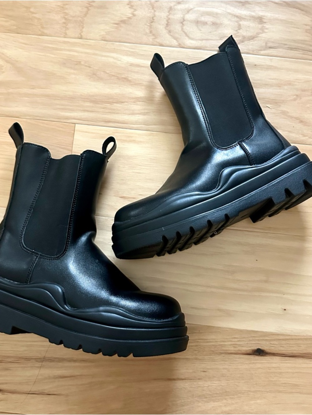 Black leather Chelsea boots with chunky lug sole